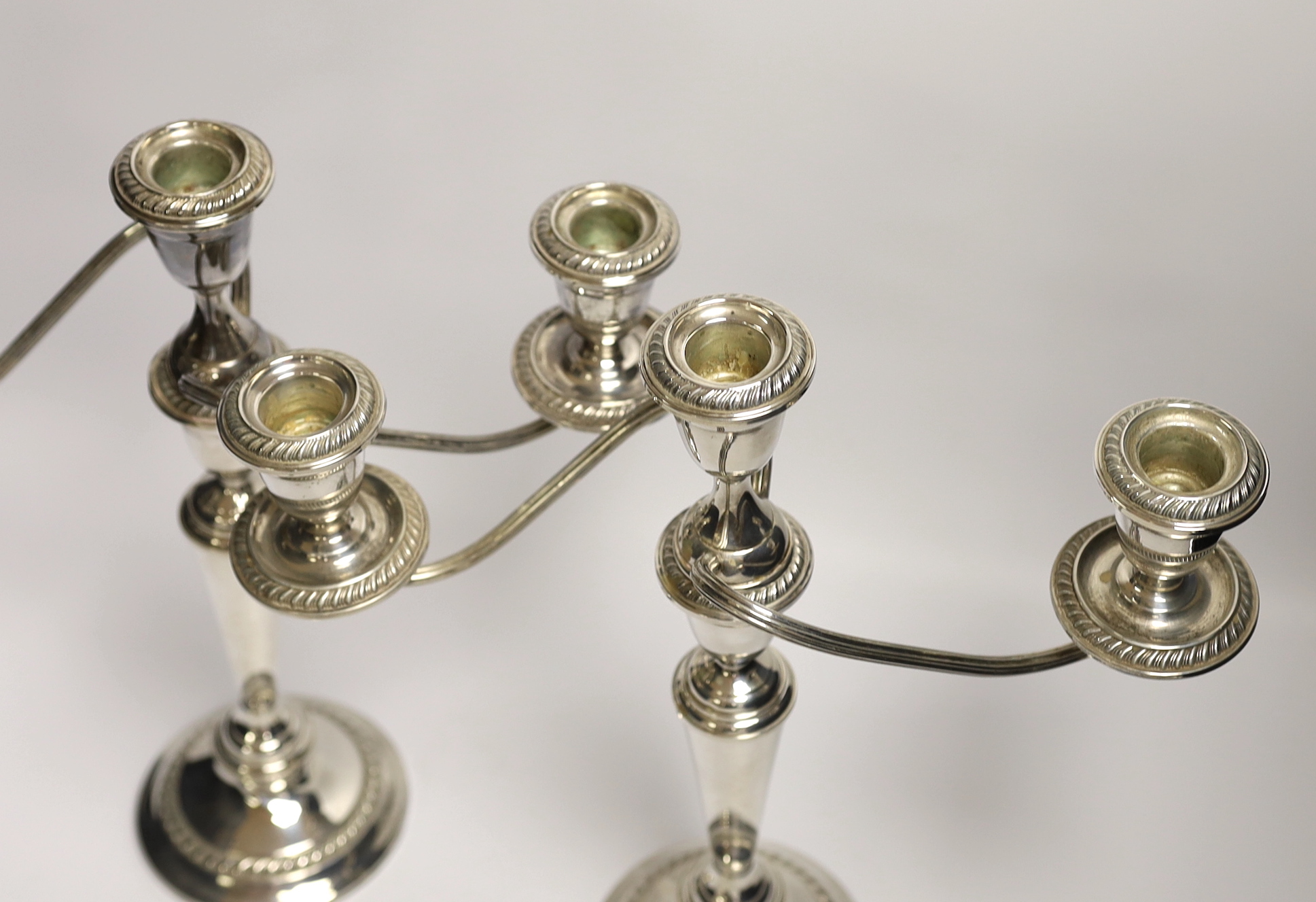 A pair of 20th century Alvin sterling three light, two branch candelabra, height 32.1cm, weighted